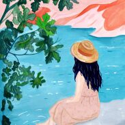 Femme assise près d'un lac