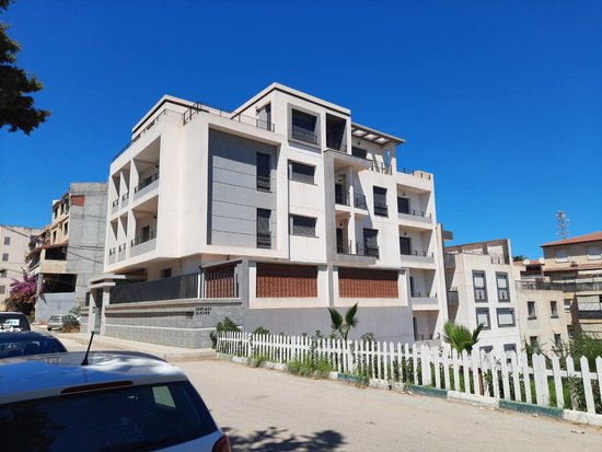 BUILDING'S FRONT AND SIDE VIEW