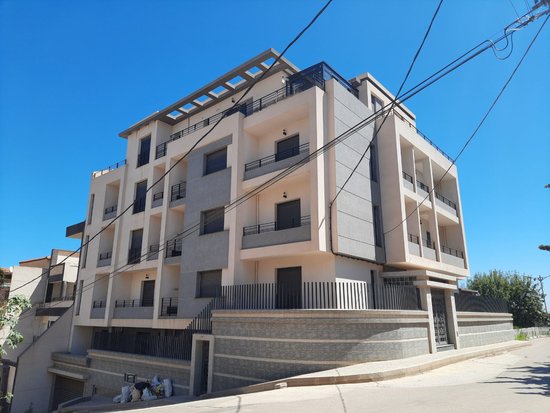 BUILDING'S FRONT AND SIDE VIEW