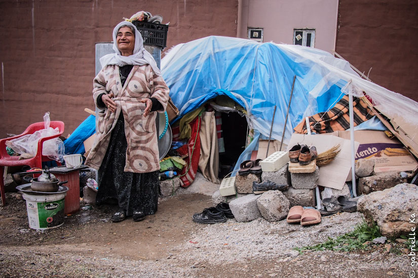 © Gabrielle Ka<br/><span>December, 2014. Gule and her 3 sons are living in this handmade shelter. They are not covered by NGO's response, but receive aid from neighborhood's charity.</span>