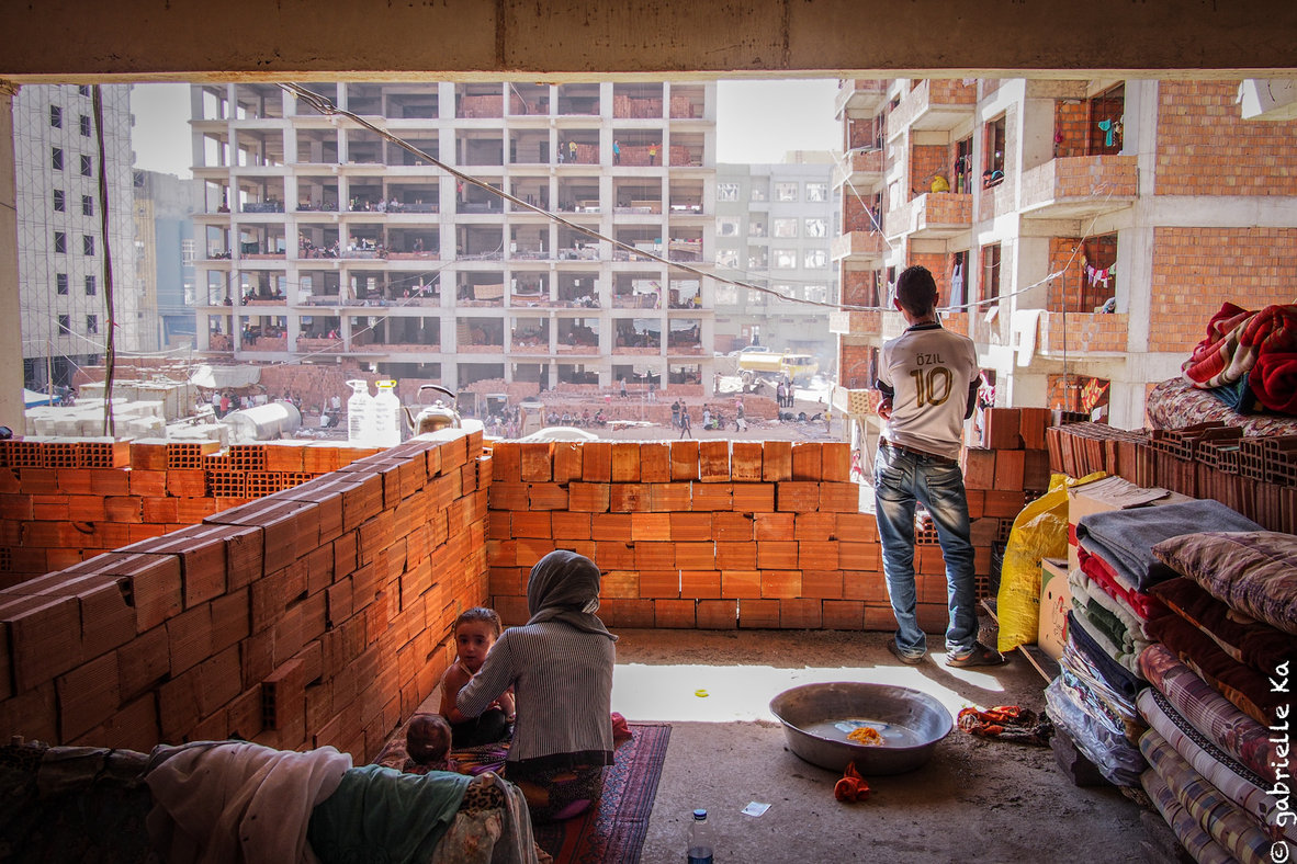 © Gabrielle Ka<br/><span>September, 2014. Winter is harsh in this region, and with no windows or heating, living conditions for people sheltering in unfinished buildings will be extremely precarious.</span>